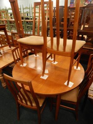 A retro style teak extending dining table