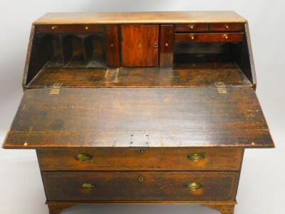 An early 19thC North Country oak and mahogany crossbanded bureau - 2