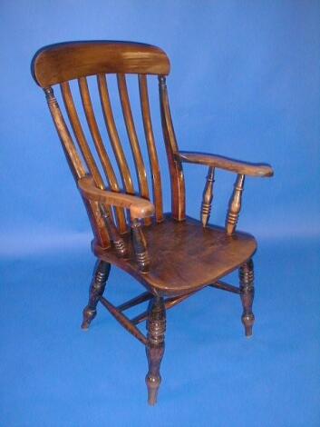 A Victorian beech and elm lath back grandfather chair