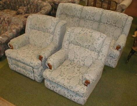 A modern green and white damask upholstered three piece suite