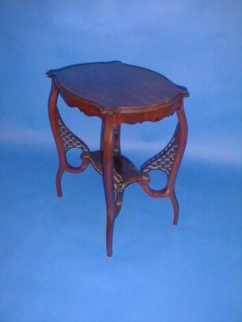 A late Victorian mahogany window table with under shelf