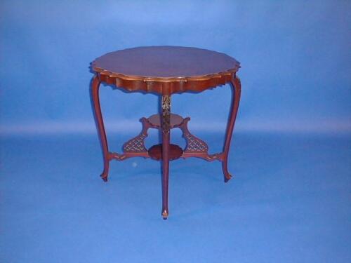 A late Victorian mahogany window table with pie-crust edge