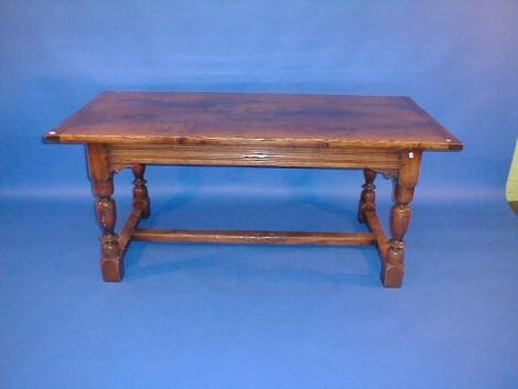 A reproduction oak refectory table