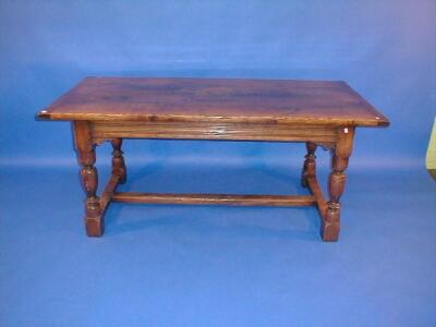 A reproduction oak refectory table