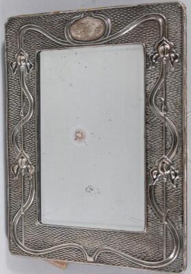 An Edwardian Art Nouveau silver mirror