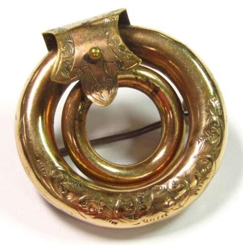 An early 20thC buckle and circle brooch