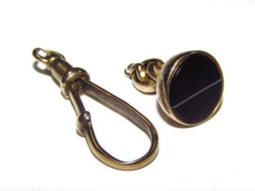 A miniature watch chain fob seal