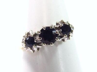 An 18ct gold sapphire and diamond ring