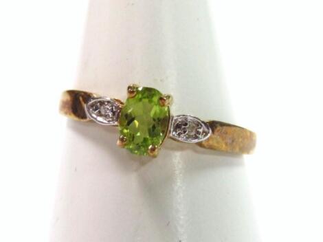 A 9ct gold peridot dress ring