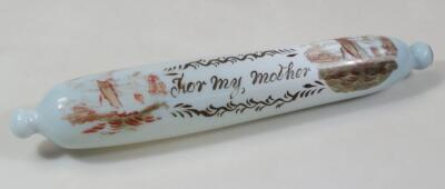 A 19thC milk glass rolling pin