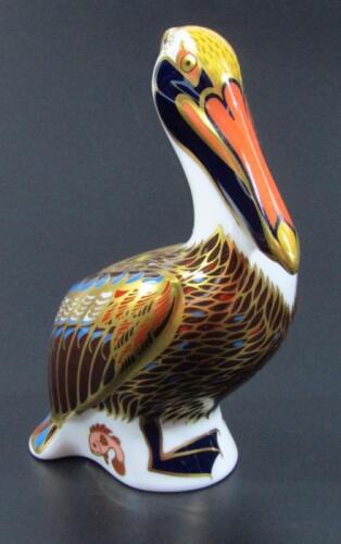 A Royal Crown Derby paperweight figure