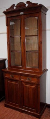 A late 19thC glazed bookcase