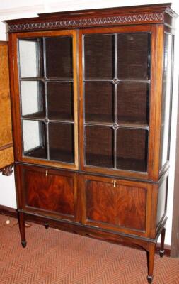 An early 20thC mahogany finish display cabinet