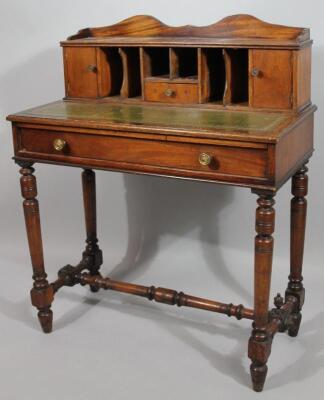 An early 20thC oak and mahogany desk