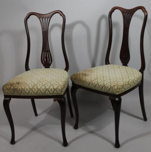 A pair of Edwardian mahogany framed dining chairs