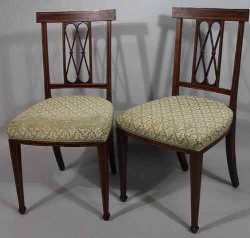 A pair of Sheraton revival mahogany and inlaid dining chairs
