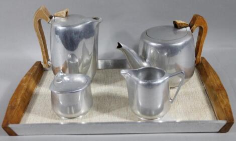 A five piece Picquot ware service