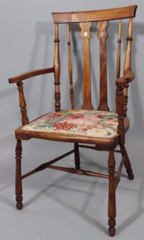 A 20thC polished Arts & Crafts style occasional chair