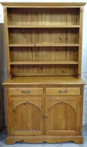 A stripped and lightly polished pine dresser