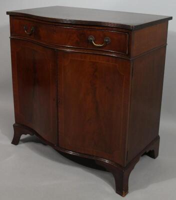 A 20thC mahogany serpentine fronted side cabinet