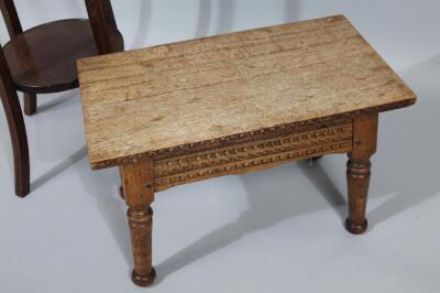 An early 20thC oak stool - 2