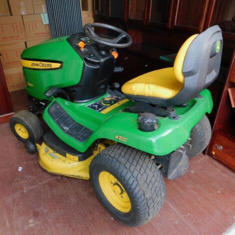 A John Deere X304 ride on lawn mower