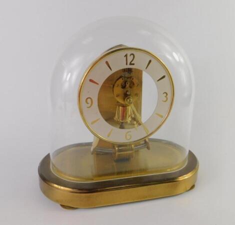 A Kundo battery operated brass mantel clock