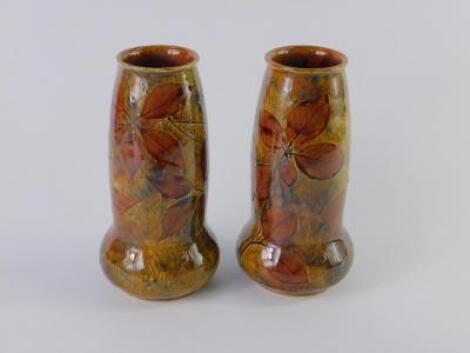 A pair of Royal Doulton stoneware natural foliage vases