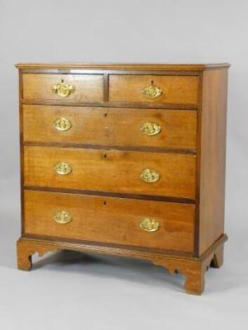 A Victorian oak and mahogany cross banded chest of drawers