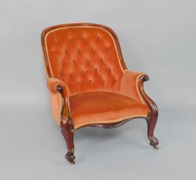 A Victorian mahogany spoon back nursing chair