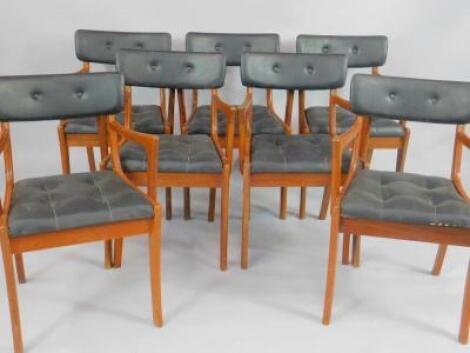 A set of seven 1970's Heals teak carver dining chairs