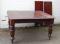 An Edwardian mahogany wind-out dining table