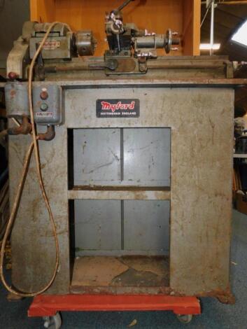 A Myford ML10 lathe and cabinet stand.