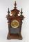 A Continental late 19thC walnut and pine mantel clock