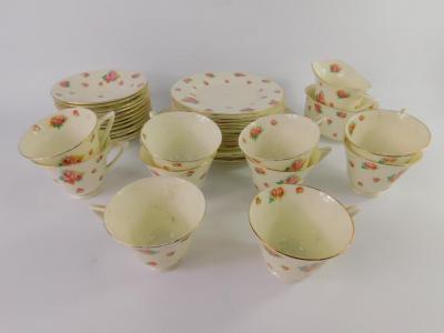 A Royal Doulton porcelain part tea service decorated with roses