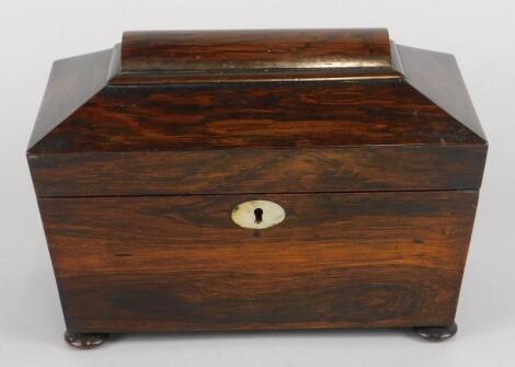 An early Victorian rosewood sarcophagus shaped tea caddy