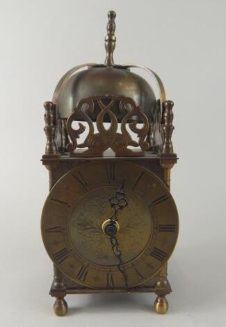 A brass lantern type clock