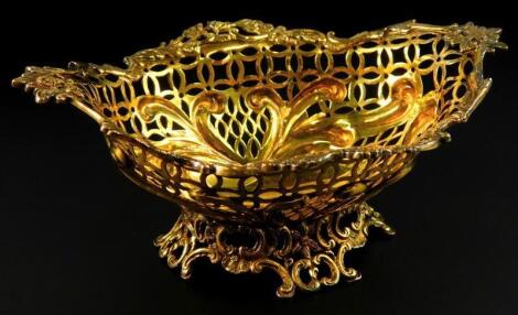 A late Victorian silver gilt pierced bon bon dish or basket