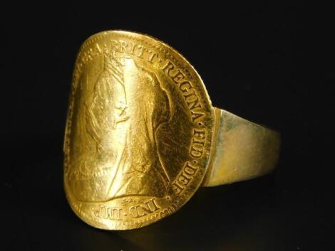 A Victorian half gold sovereign dress ring