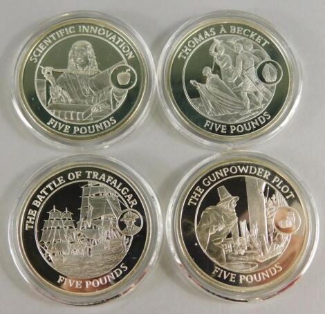 Four silver five pound commemorative coins