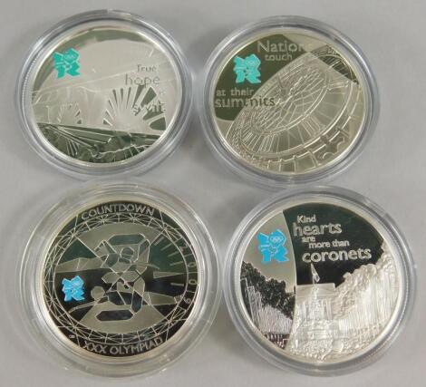 Four silver five pound coins