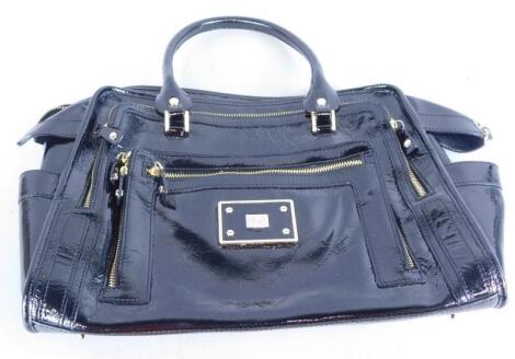 An Anya Hindmarch patent leather handbag