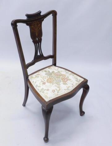 An Edwardian mahogany and marquetry side chair