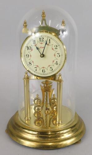 A Kundo brass anniversary clock