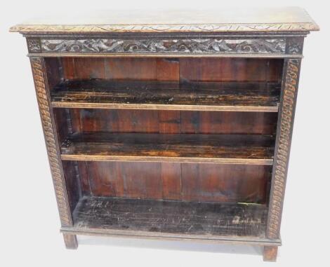 A late Victorian/Edwardian carved oak open bookcase