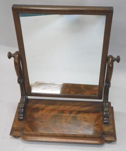 A Victorian figured mahogany dressing table mirror