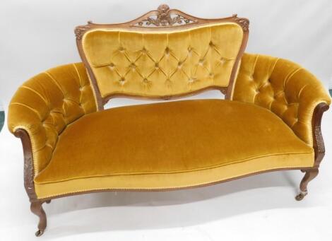 An Edwardian mahogany show-frame sofa