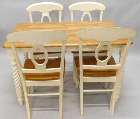 A Laura Ashley type cream painted hardwood kitchen table and four matching chairs