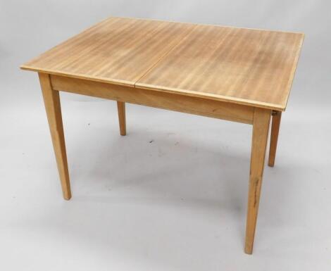 A Gordon Russell Limited teak extending dining table