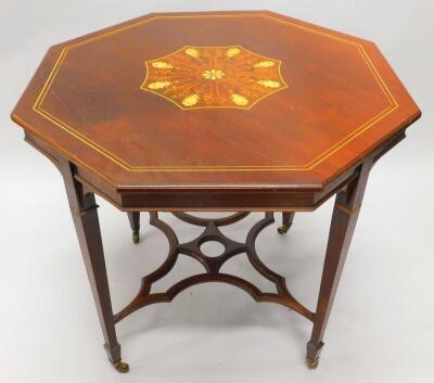 An Edwardian mahogany window table